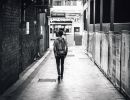 man walking down street