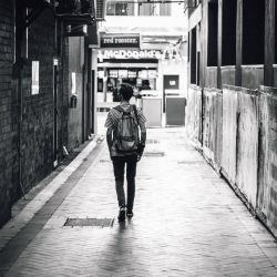 man walking down street